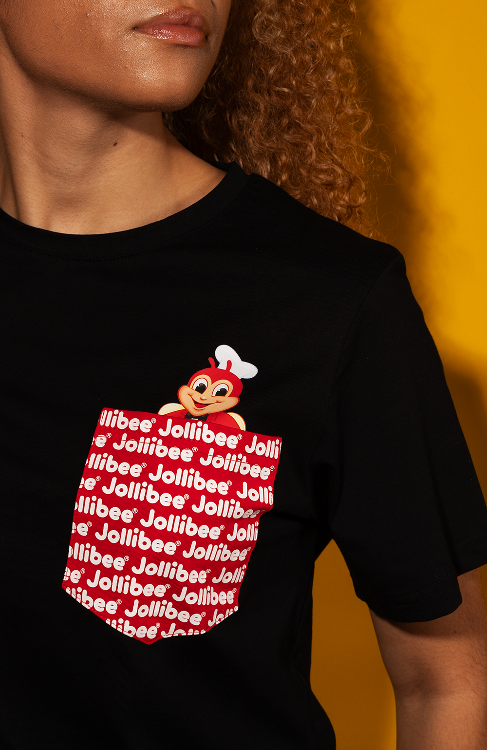 girl wearing the Jollibee black pocket tee
