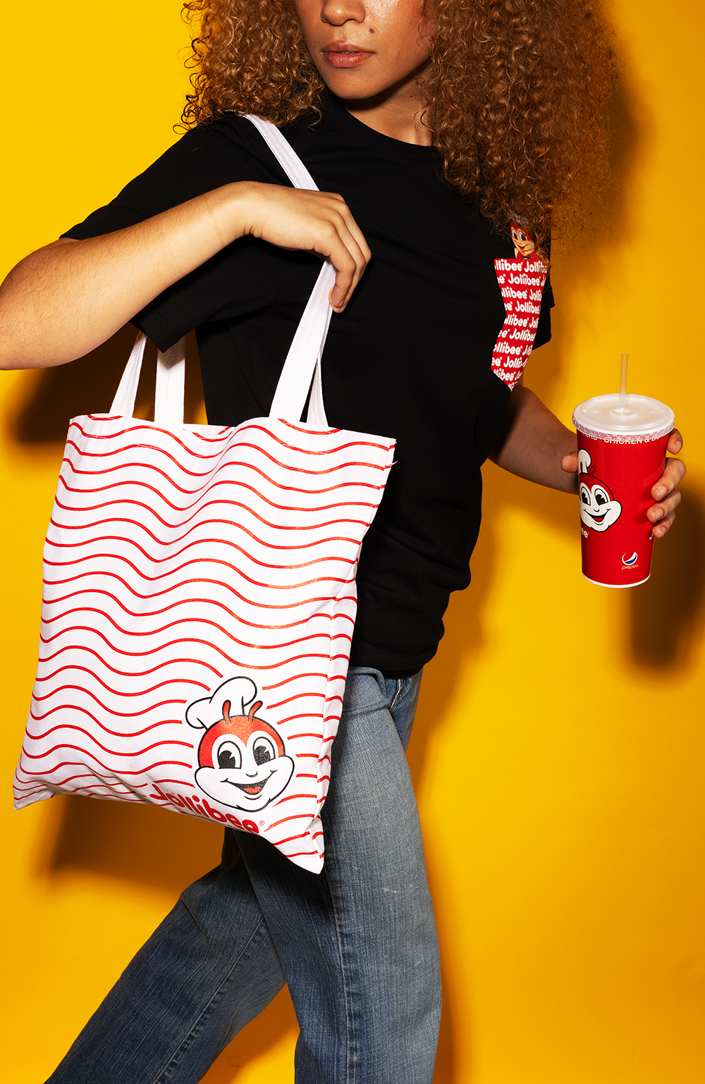 girl wearing the black pocket tee and Jollibee wavy tote bag