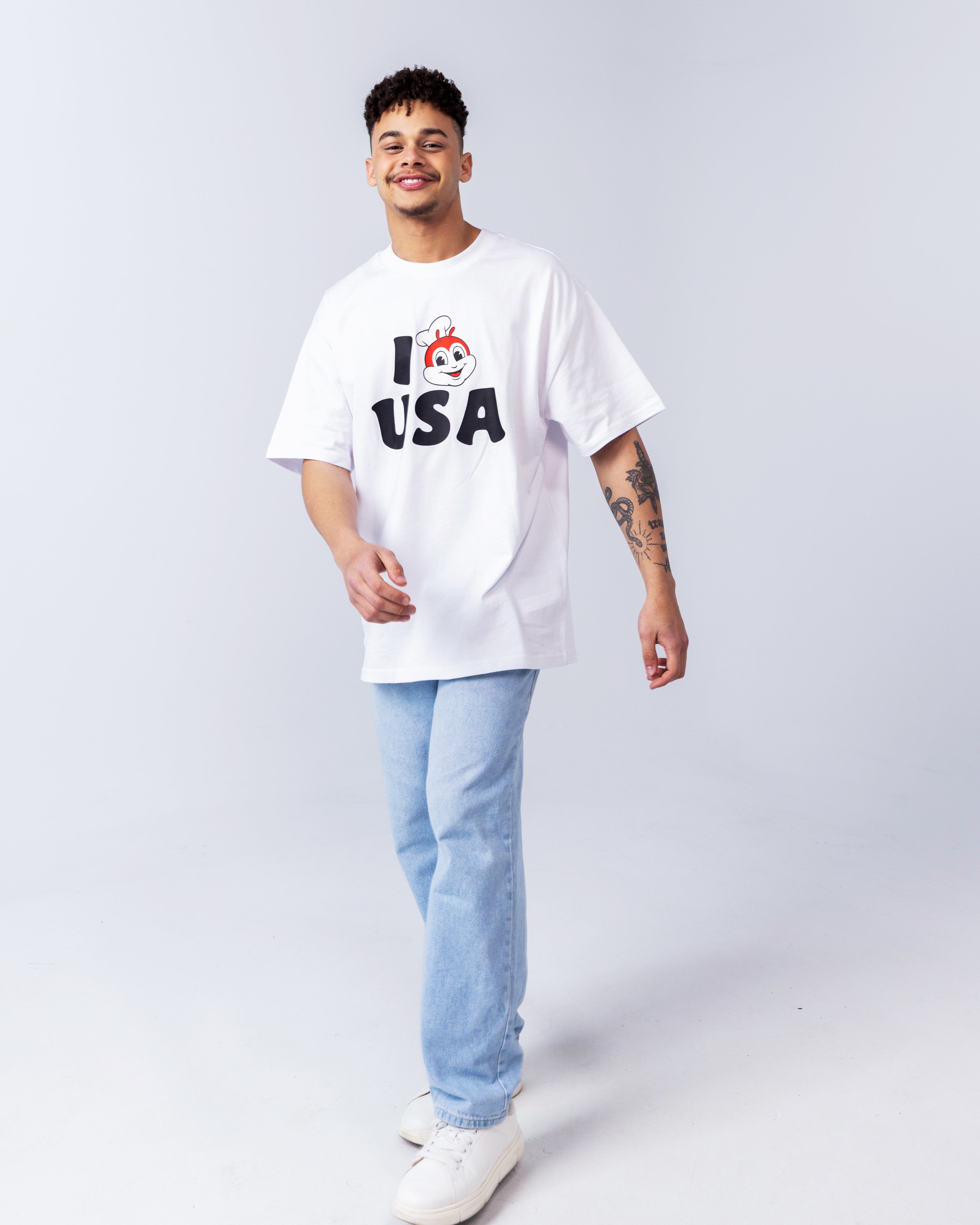 smiling guy wearing the I JB USA white shirt