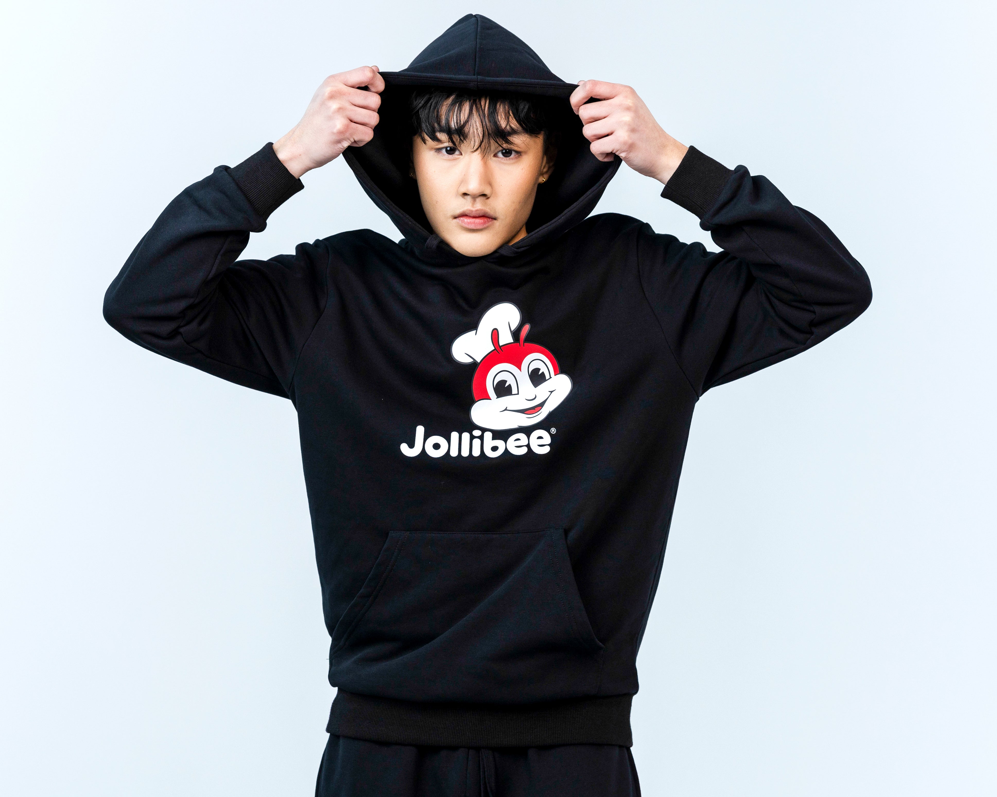 guy wearing the Jollibee Classic Black Hoodie