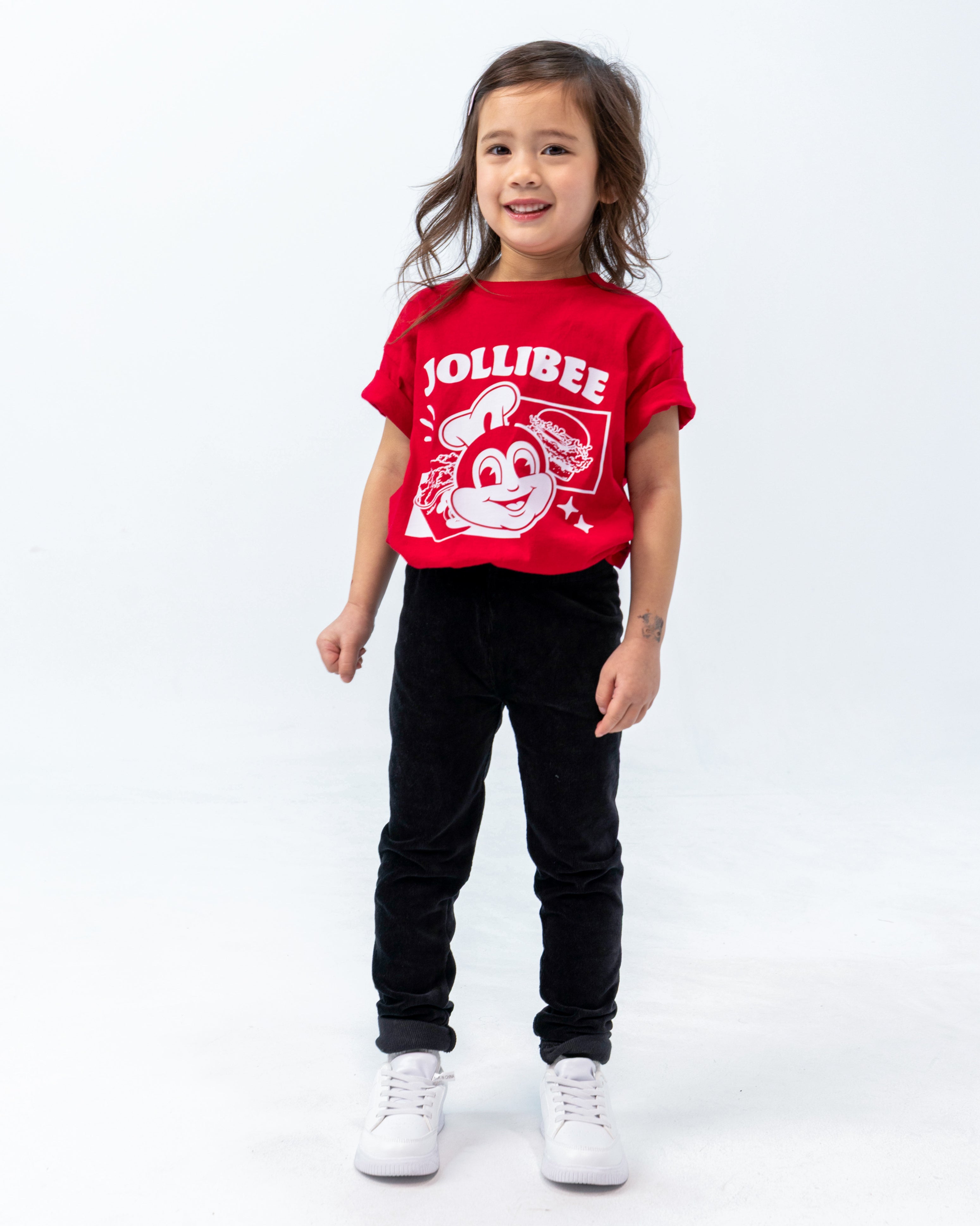 smiling little girl wearing the Jollibee merch kid retro red shirt