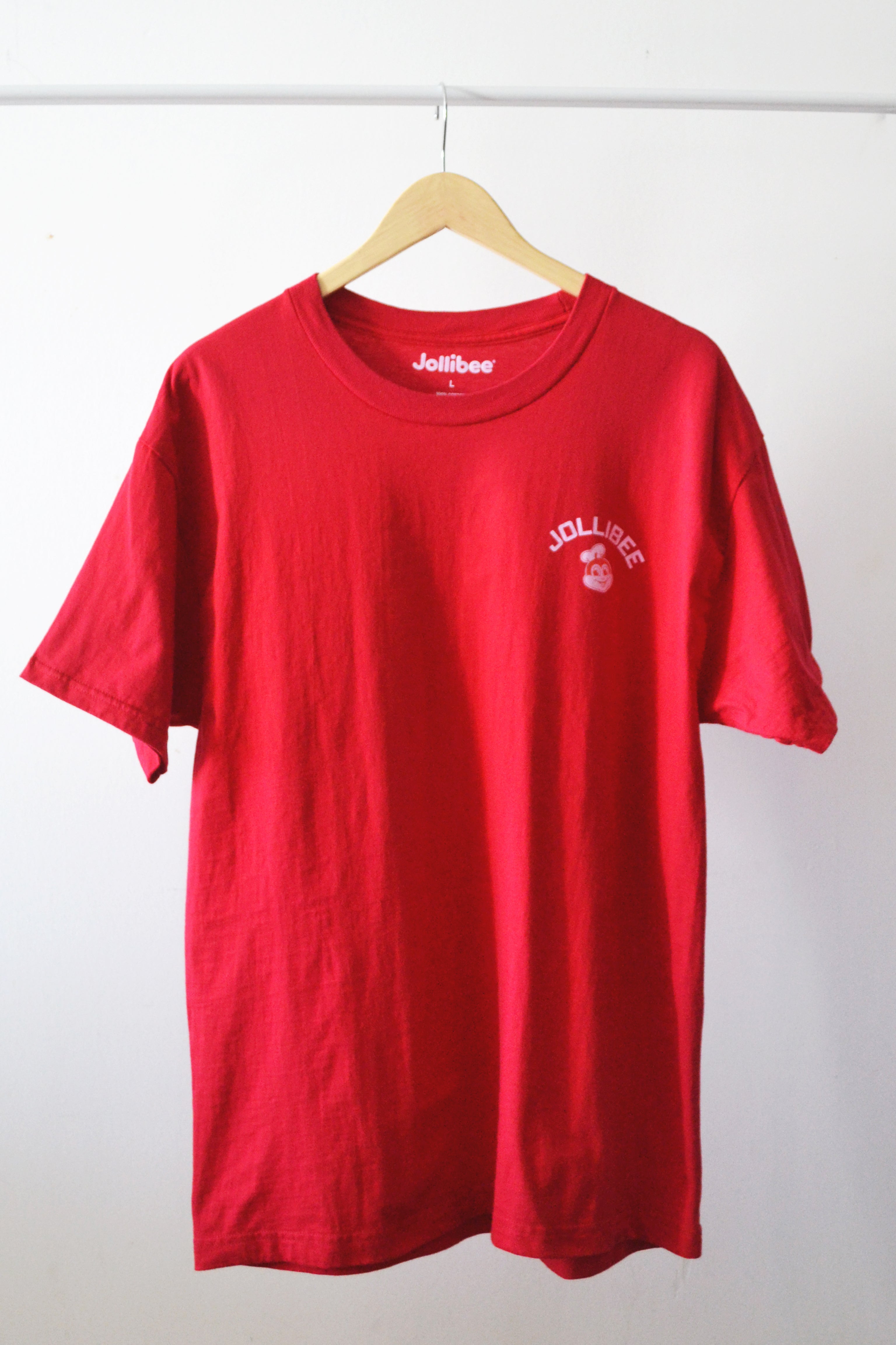 Jollibee red shirt on a hanger